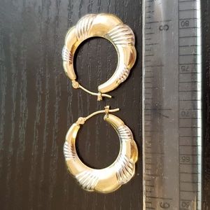 10K gold hoop earrings.
